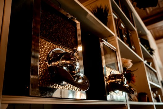 Stylish vintage coffee bean dispensers on shelves in a cozy café.