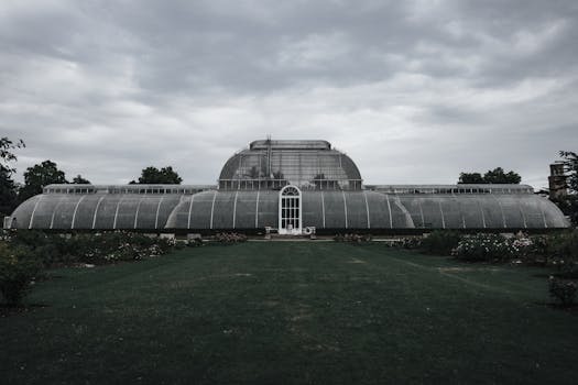 Stunning architecture of the Royal Botanic Gardens, Kew in London under a moody sky.
