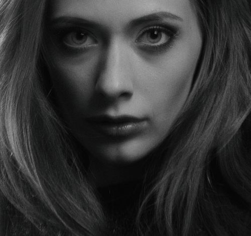 Free Grayscale close-up portrait of a woman with expressive eyes and flowing hair. Stock Photo