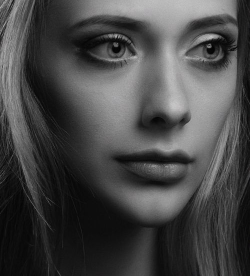 Free Close-up black and white portrait capturing a woman's thoughtful expression. Stock Photo