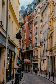 Discover the narrow, cobblestone streets of Montmartre, Paris, lined with historic architecture.