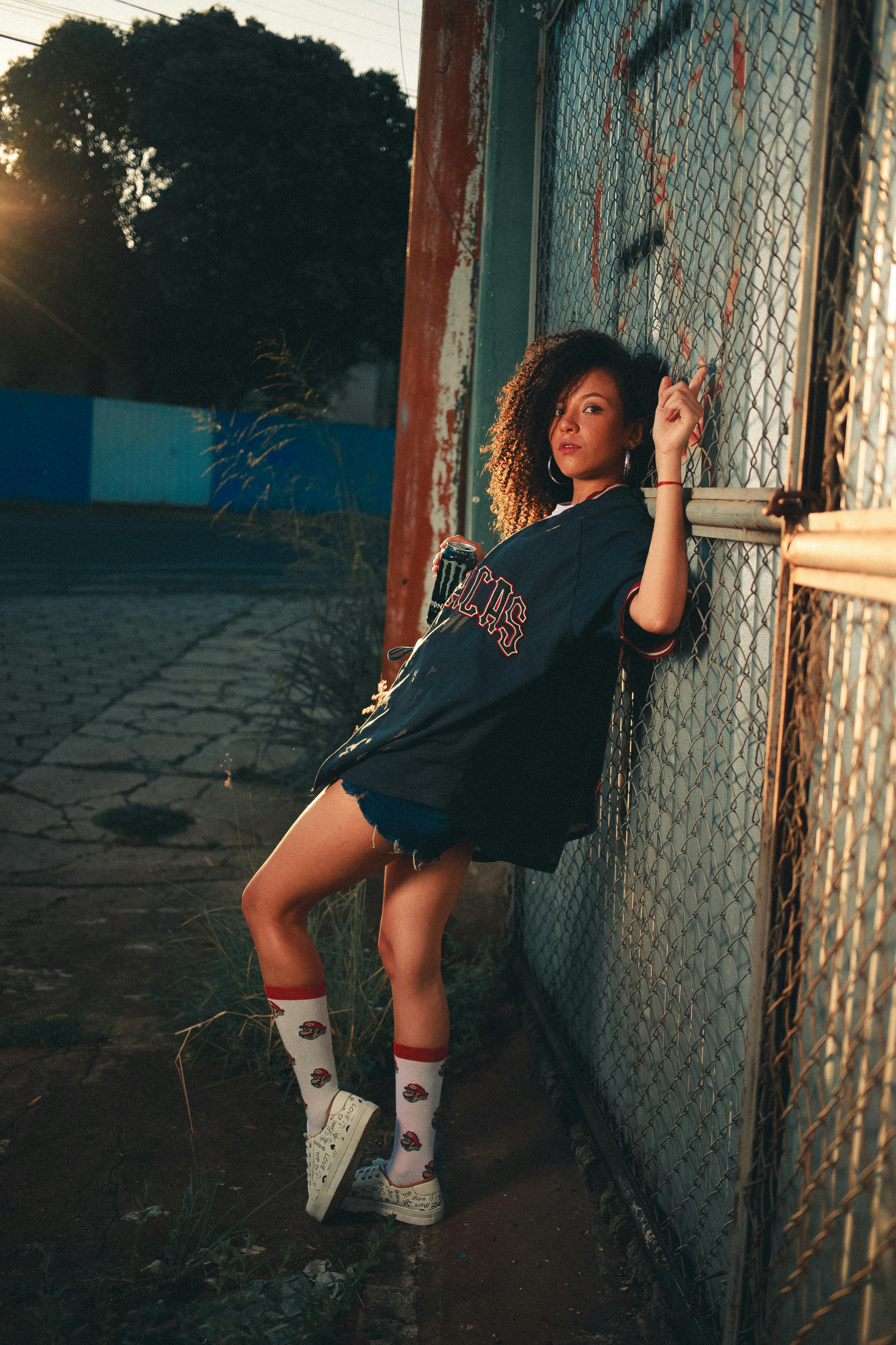 A Woman Wearing a Bikini and Denim Shorts · Free Stock Photo