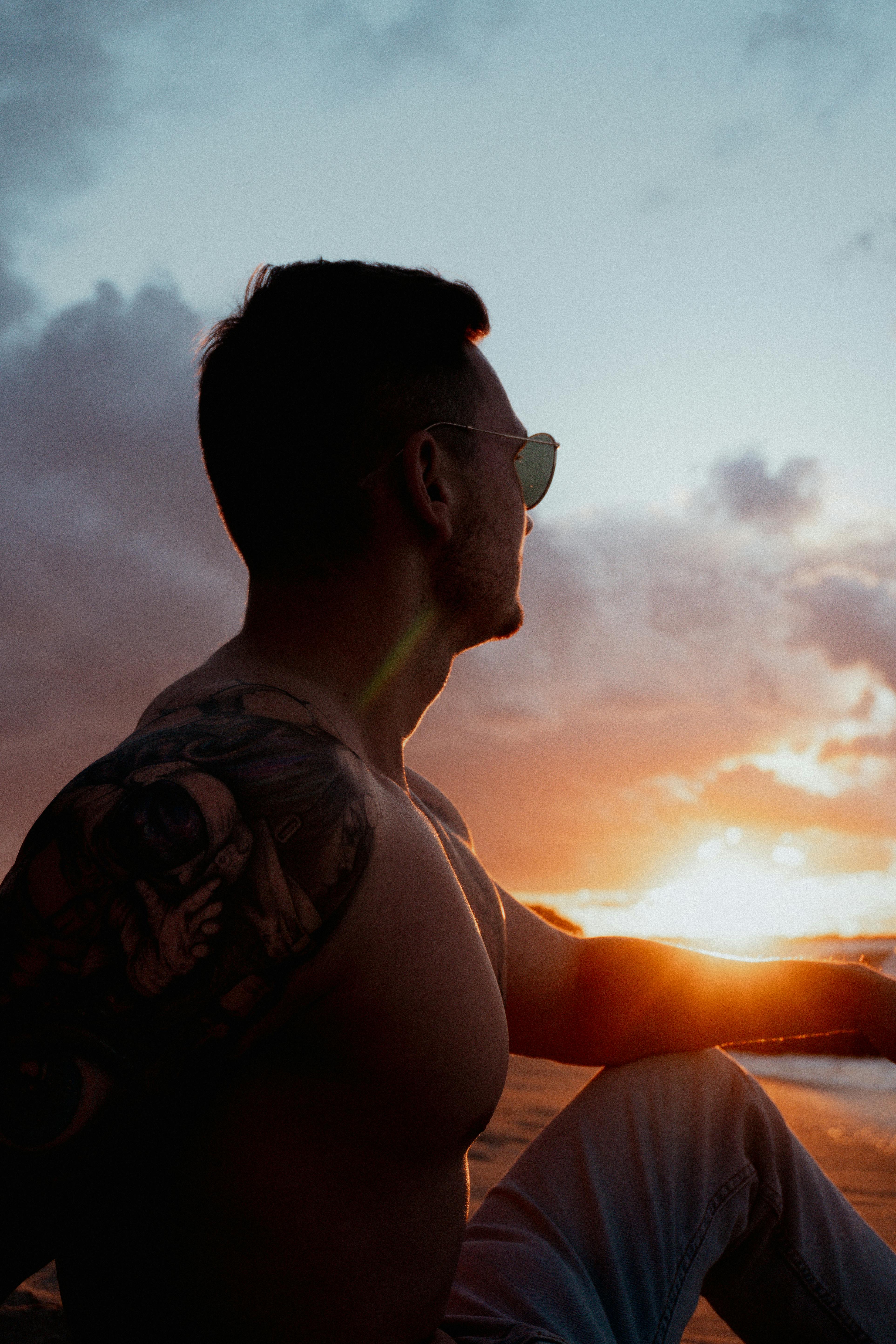 Man in Sunglasses Showing Tattoos on Fingers · Free Stock Photo