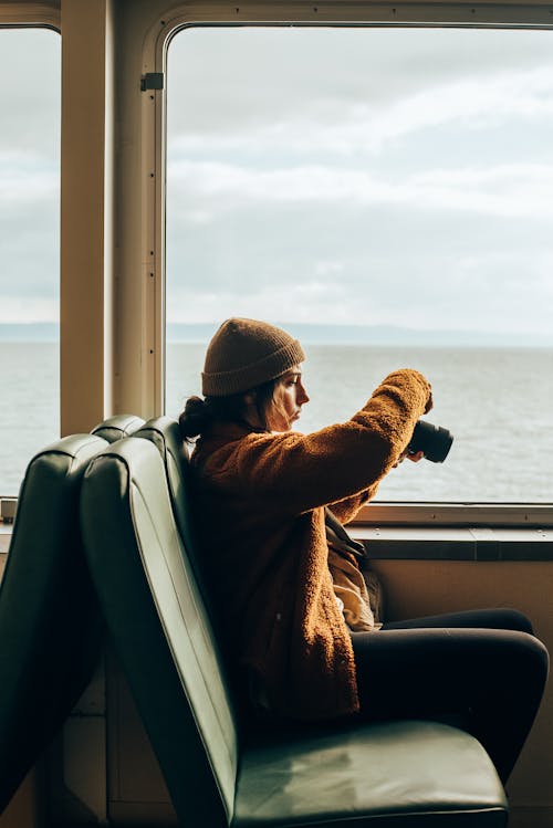 A Woman using a Camera 