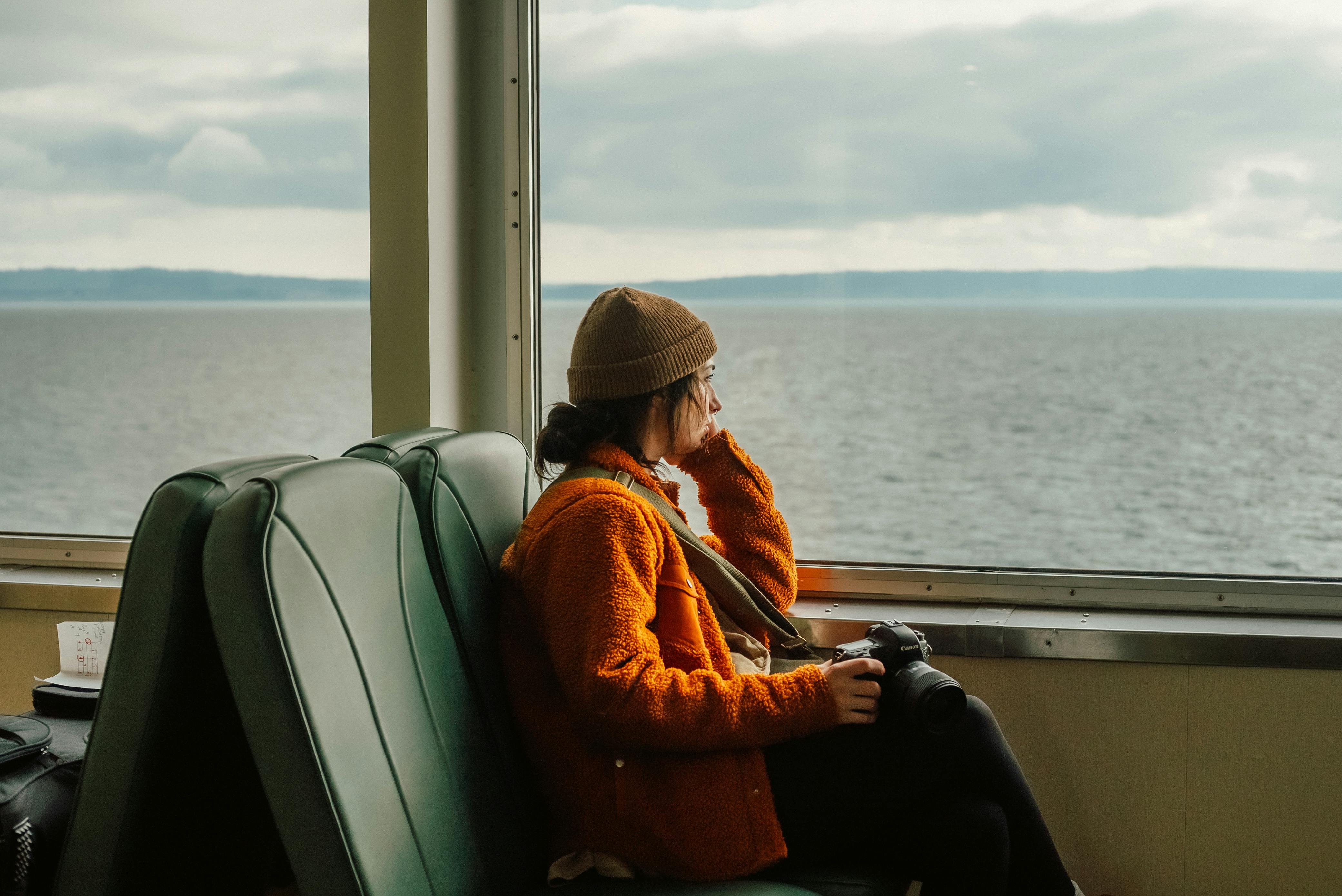 A Woman Sitting inside the Ferryboat