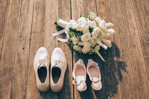 Wedding Shoes Beside a Bouquet