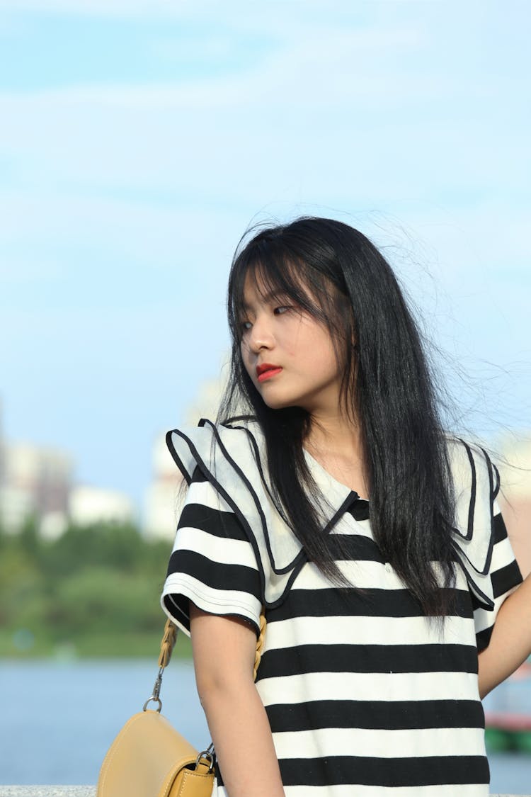 Young Woman Posing Near Water