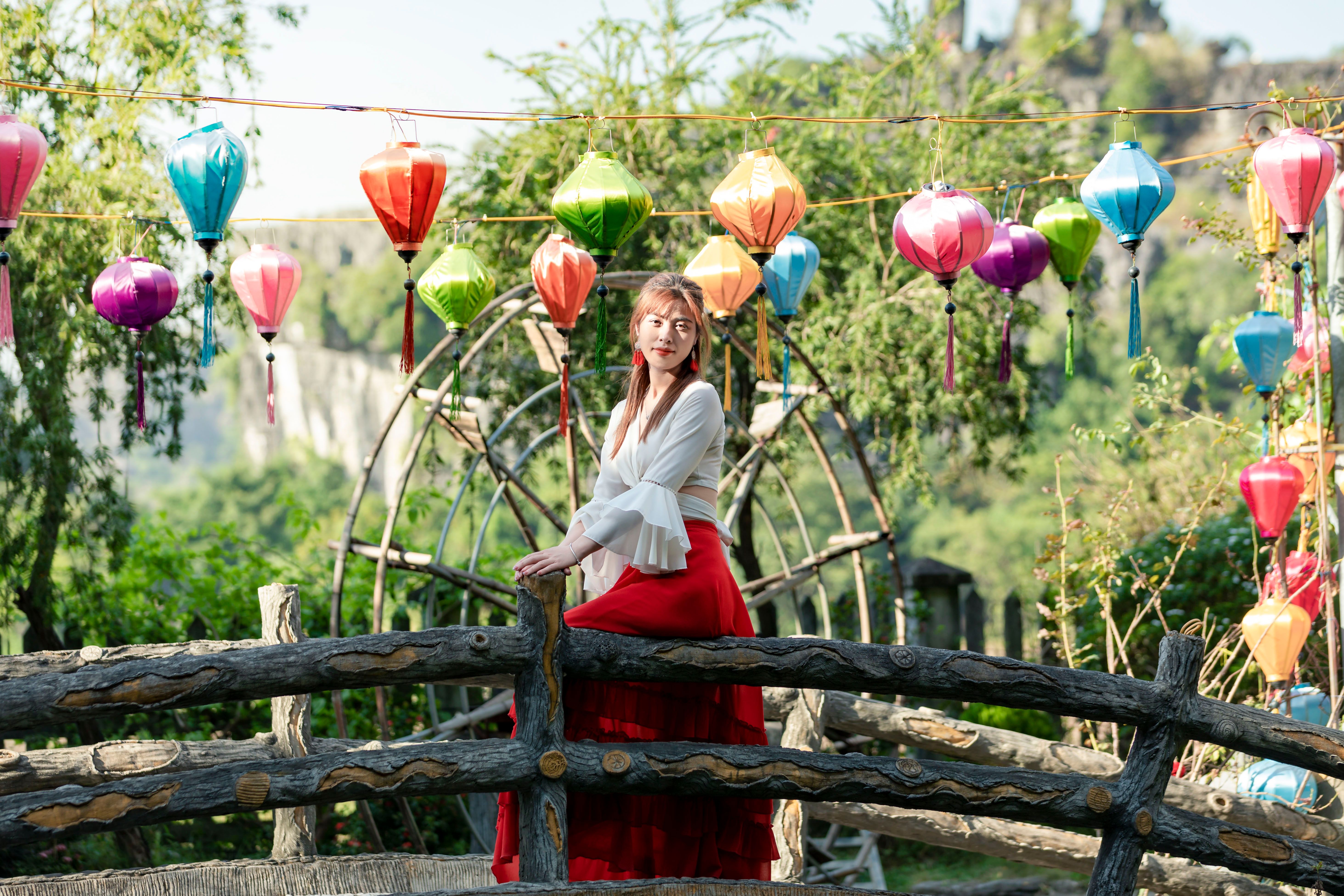 Woman in White Top and Red Skirt · Free Stock Photo