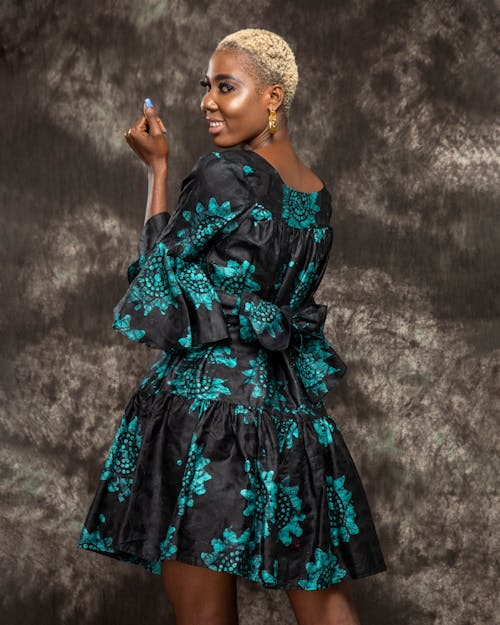 Smiling Woman in Dress Posing in Studio