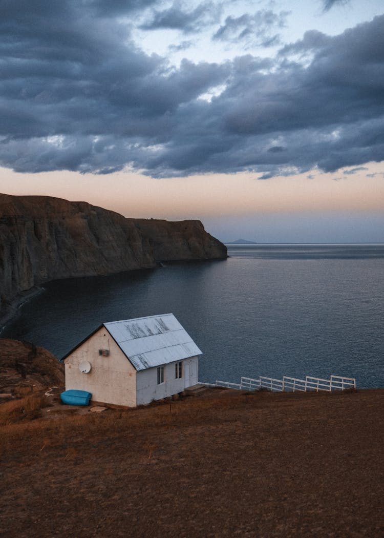 Little House On A Beach At Sunset