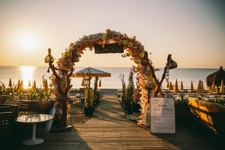 Flower Arch On Beach Wedding On Sunset