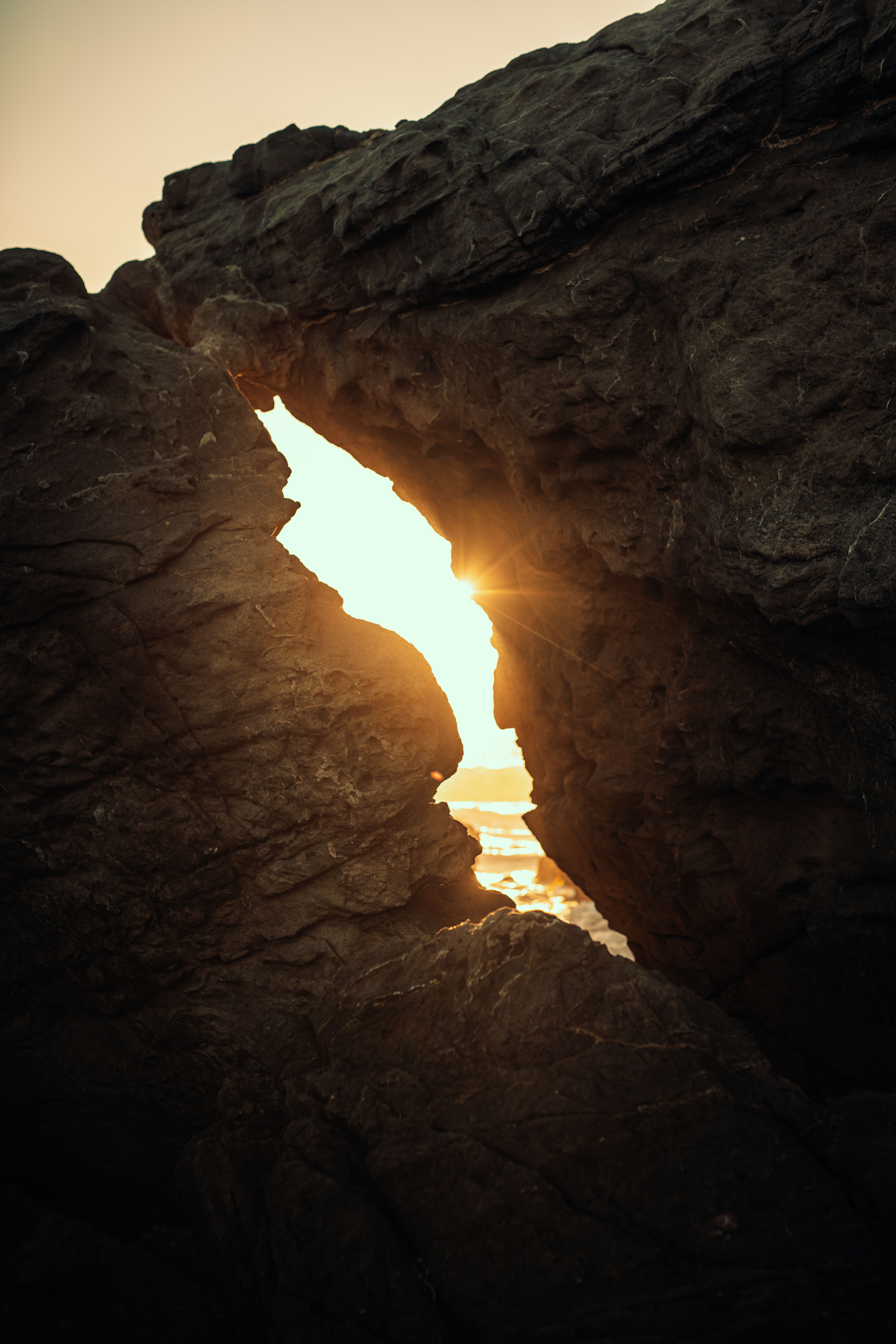 Sunbeam Shining Through Hole Between Rocks · Free Stock Photo