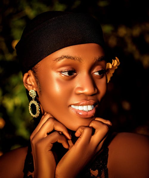 Close-up of a Beautiful Woman with Hands on Chin