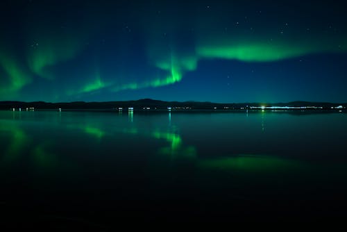 View of Northern Lights above a Body of Water