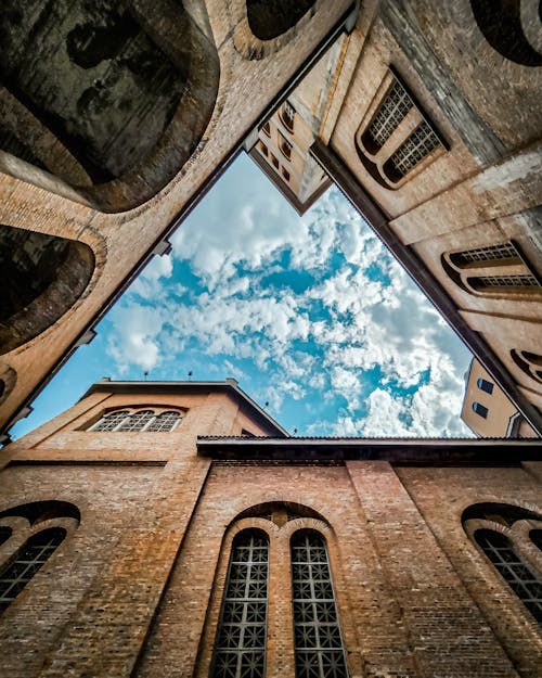 Brown Church Building Under Blue Sky and White Clouds