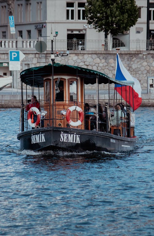 People Riding on Boat on Water