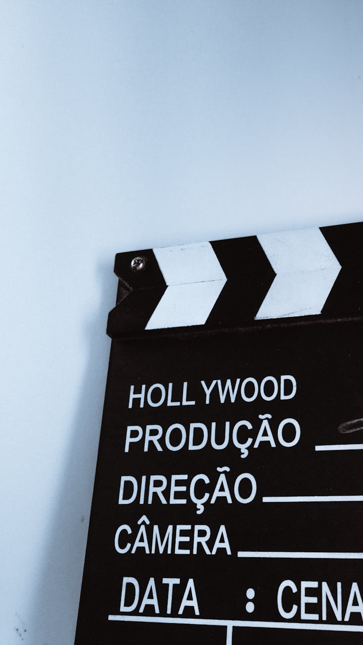 Close-up vertical shot of a clapperboard with text, ideal for film and media themes.