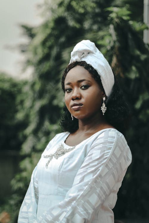 Beautiful Woman with Headscarf in White Dress