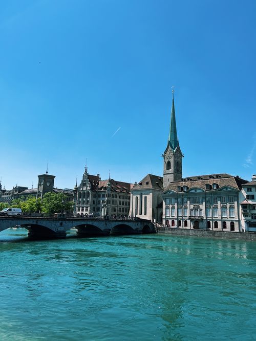 Free Captivating view of Fraumünster Church by the Limmat River in Zürich, Switzerland. Ideal travel destination. Stock Photo
