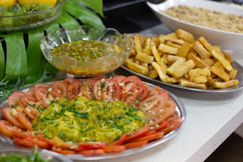 Traditional Food on Plates on Table