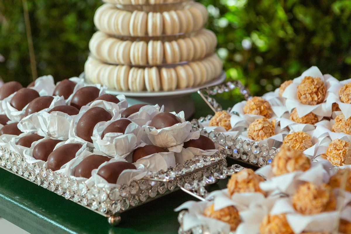 Elegant selection of chocolate and sweet desserts beautifully arranged on trays.