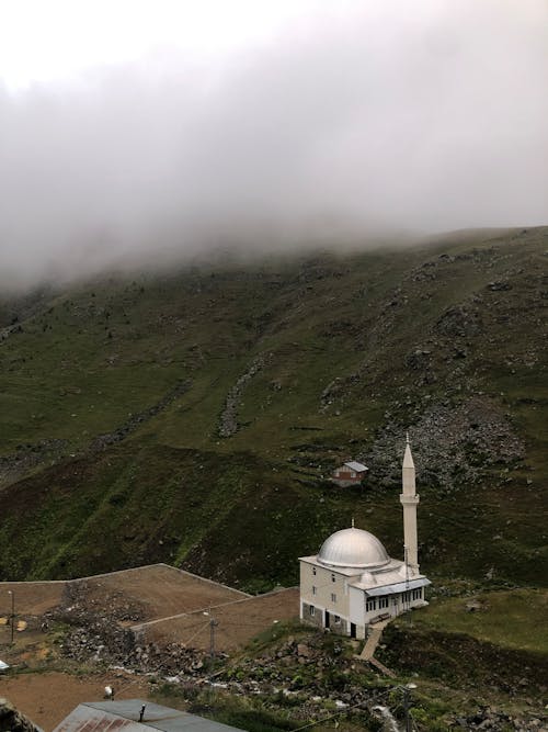 Aerial View of a Mosque in a Mountain Valley