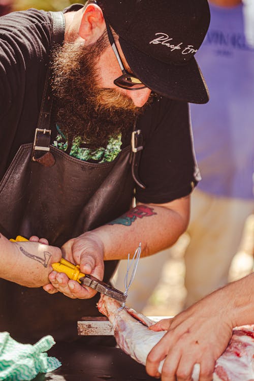 Cook Preparing the Meat 