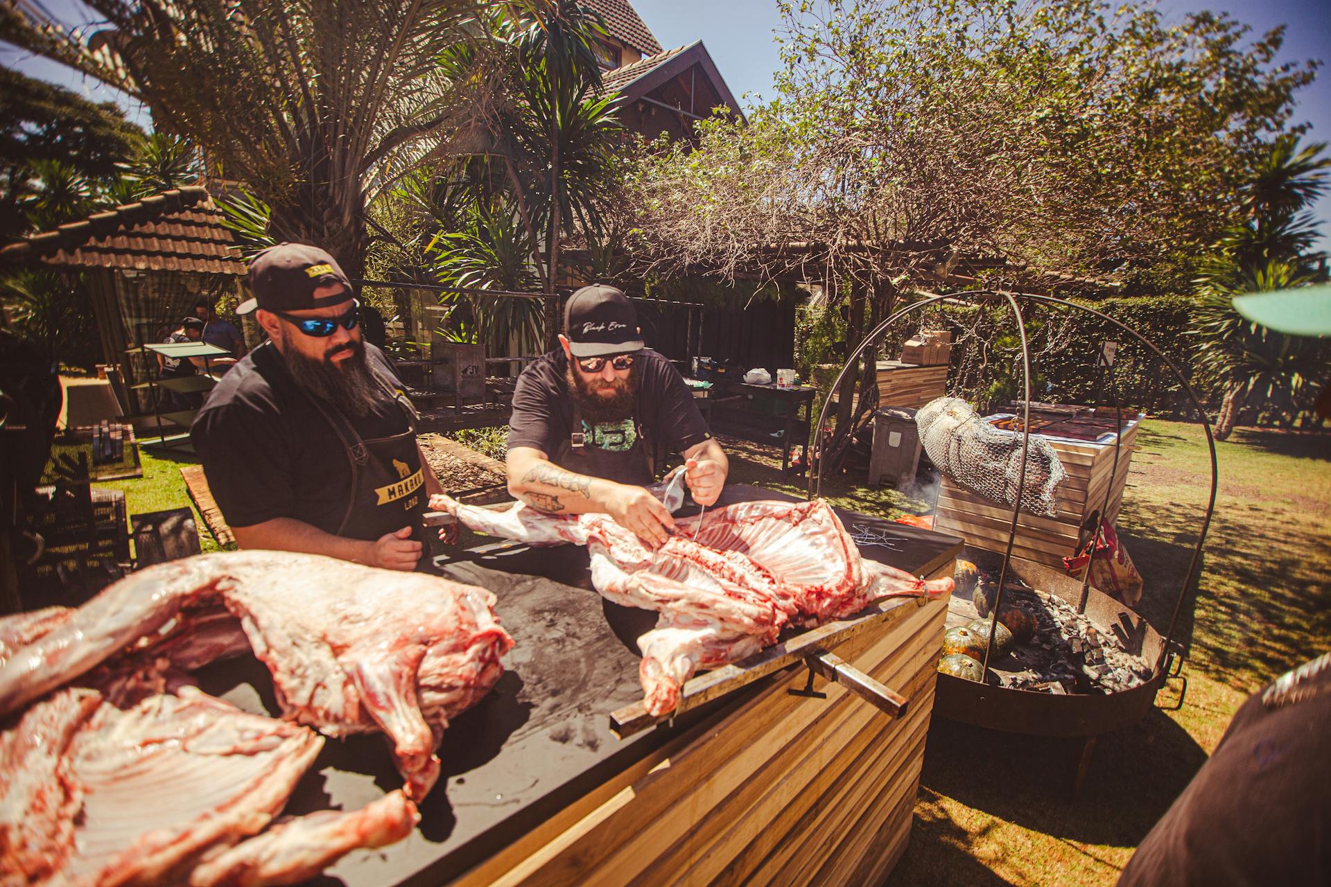 Men Butchering a Raw Meat