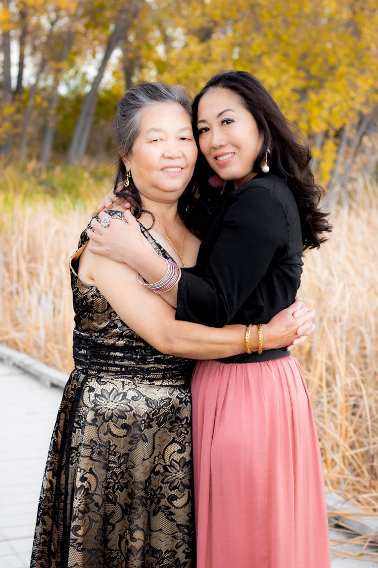 Mother And Her Adult Daughter Hugging 