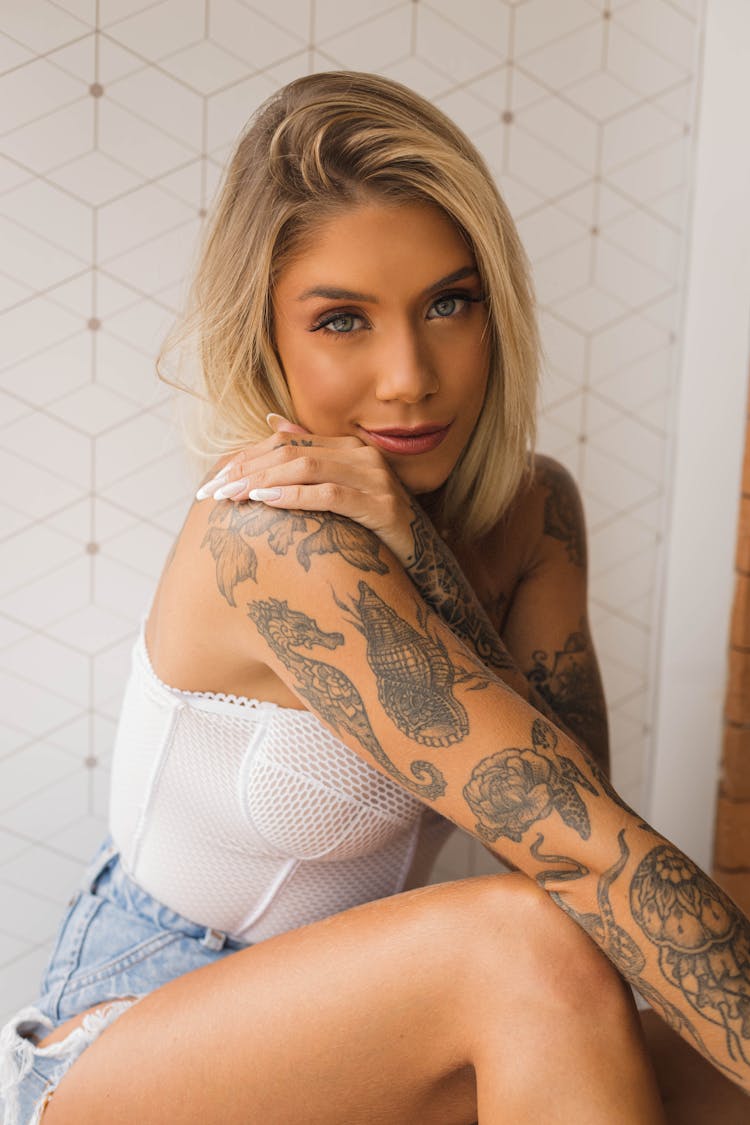 Portrait Of Seductive Blonde Woman With Tattoos