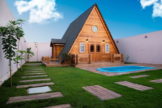 Wooden House with a Lawn 