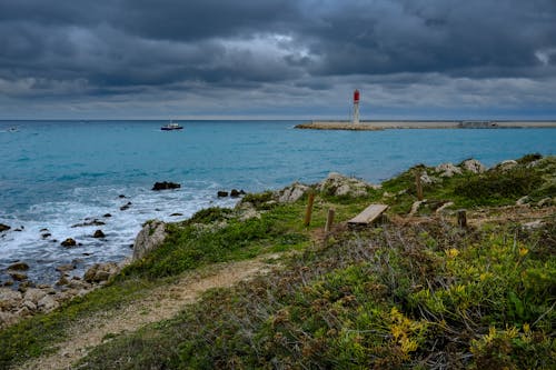 Photos gratuites de bateau, ciel spectaculaire, côte