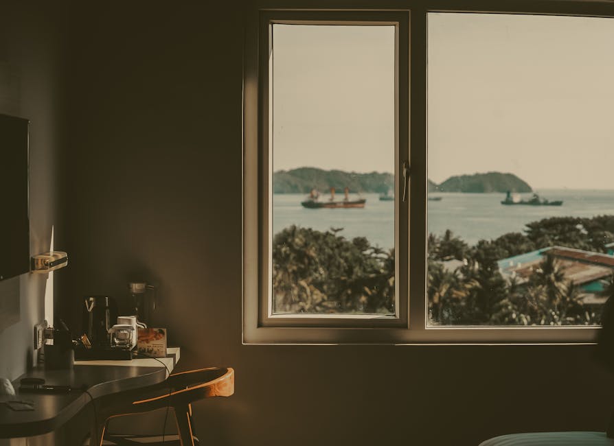 furniture shipping - Calm Indonesian sea view from a cozy room window with ships in the distance.