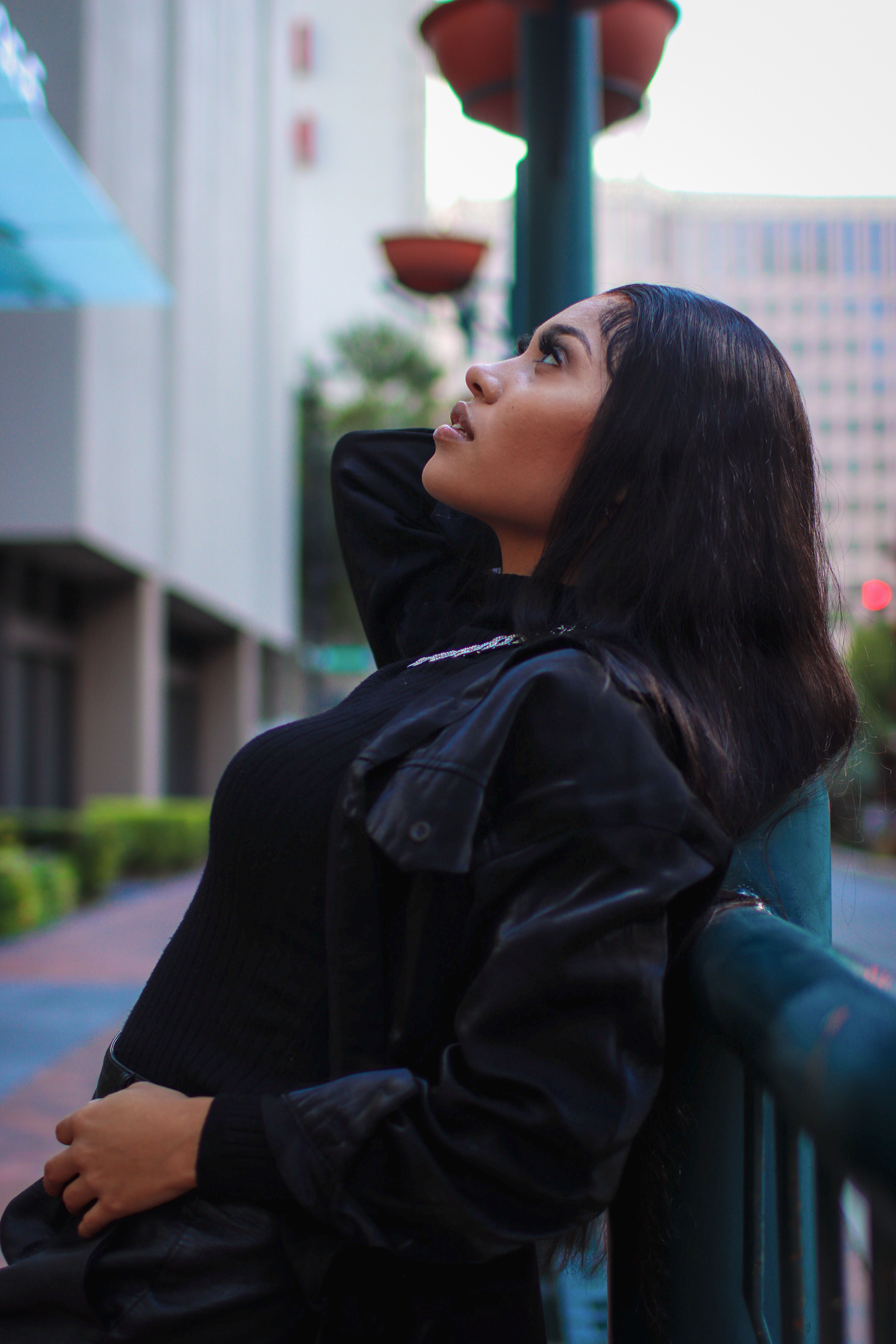 Woman in leather jacket in urban setting
