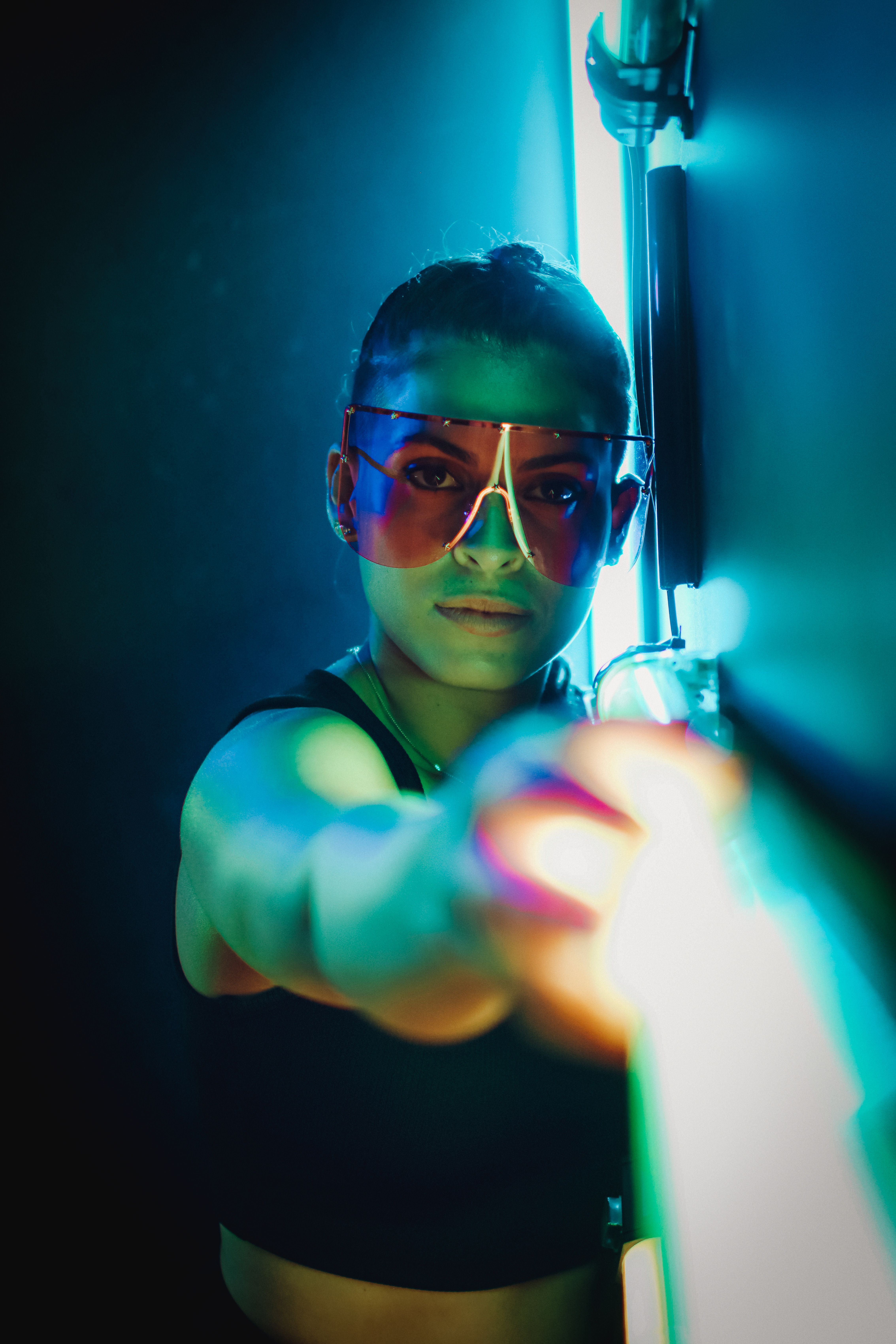 Woman in Sunglasses Touching a Mirror · Free Stock Photo