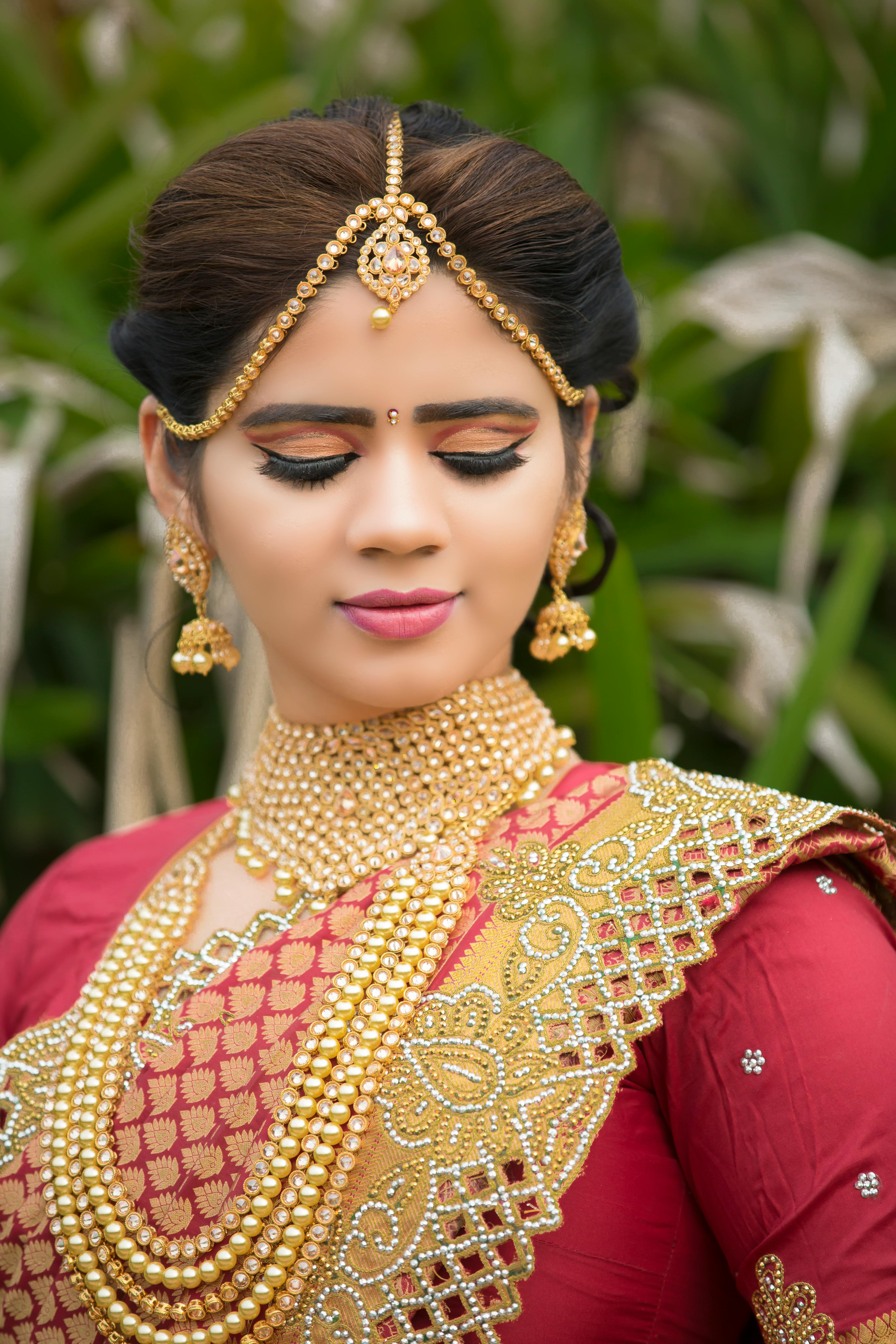 shallow focus photography of woman in red top