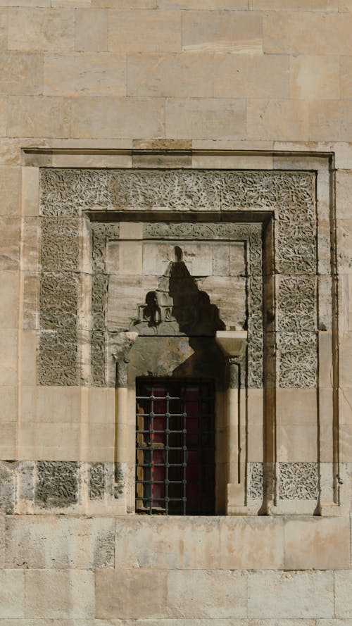 Ornate Window with Metal Bars 