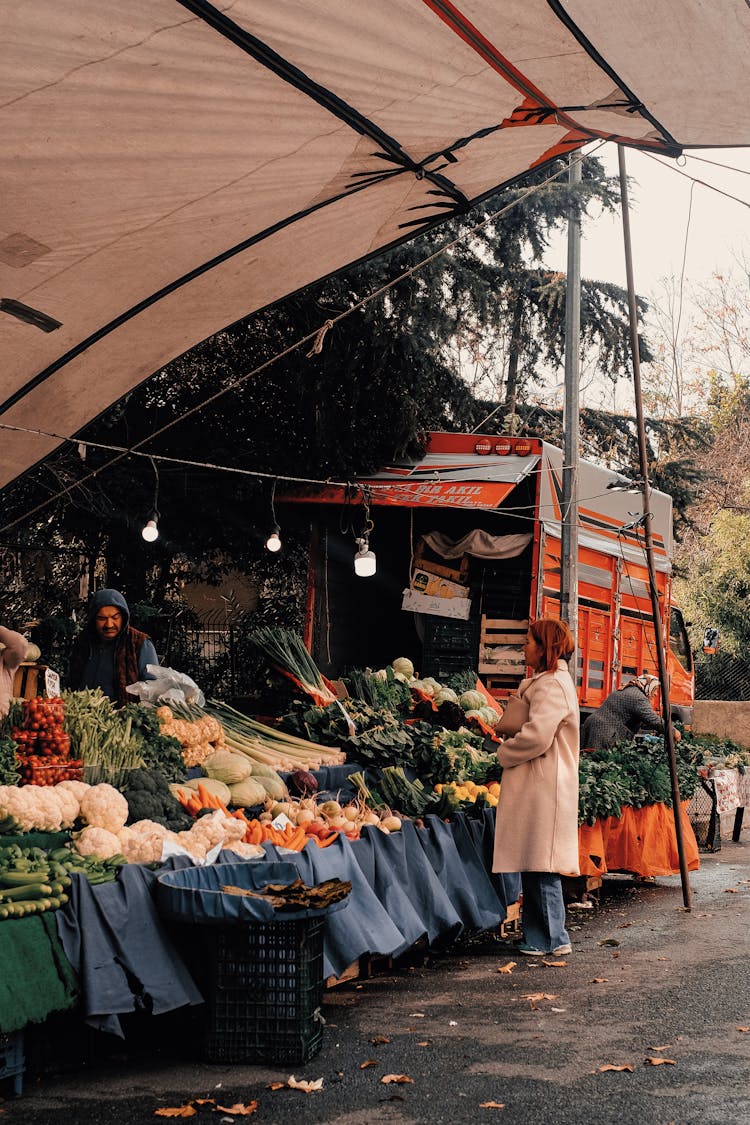 Woman Buying On Street Market