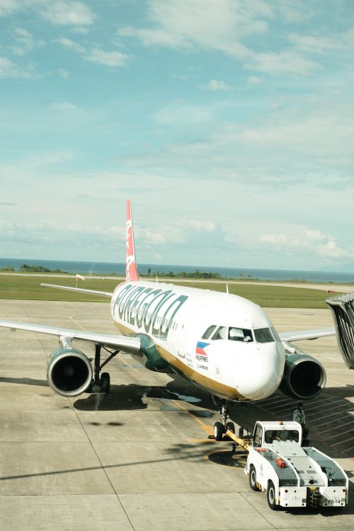 Free Passenger aircraft at Laguindingan Airport, Philippines, ready for departure on a sunny day. Stock Photo