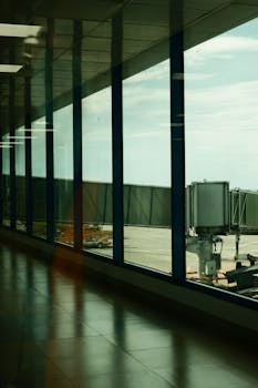 Spacious corridor in Laguindingan Airport, Northern Mindanao, showcasing modern architecture and large windows.