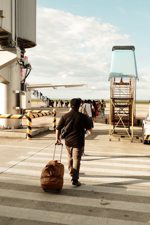 People Boarding a Plane