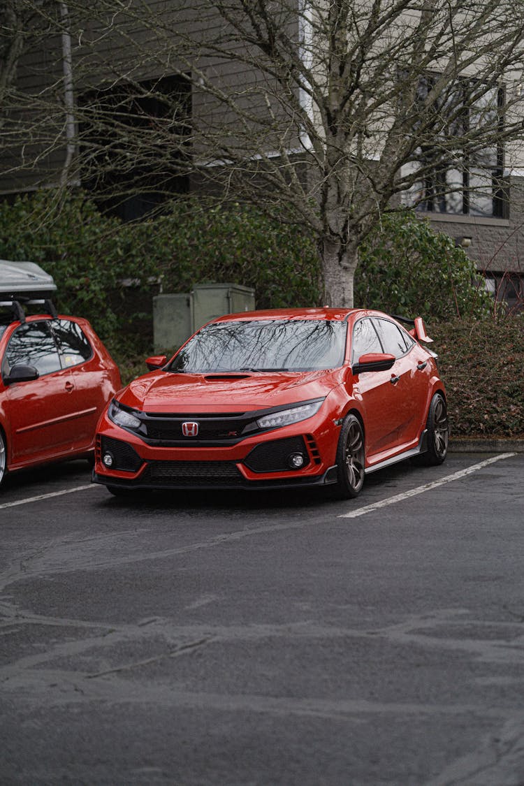 Modern Sport Car On Outdoor Parking Lot Near House