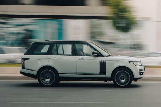 Side profile of a white SUV on an urban street — photo by Dextar Studio on Pexels