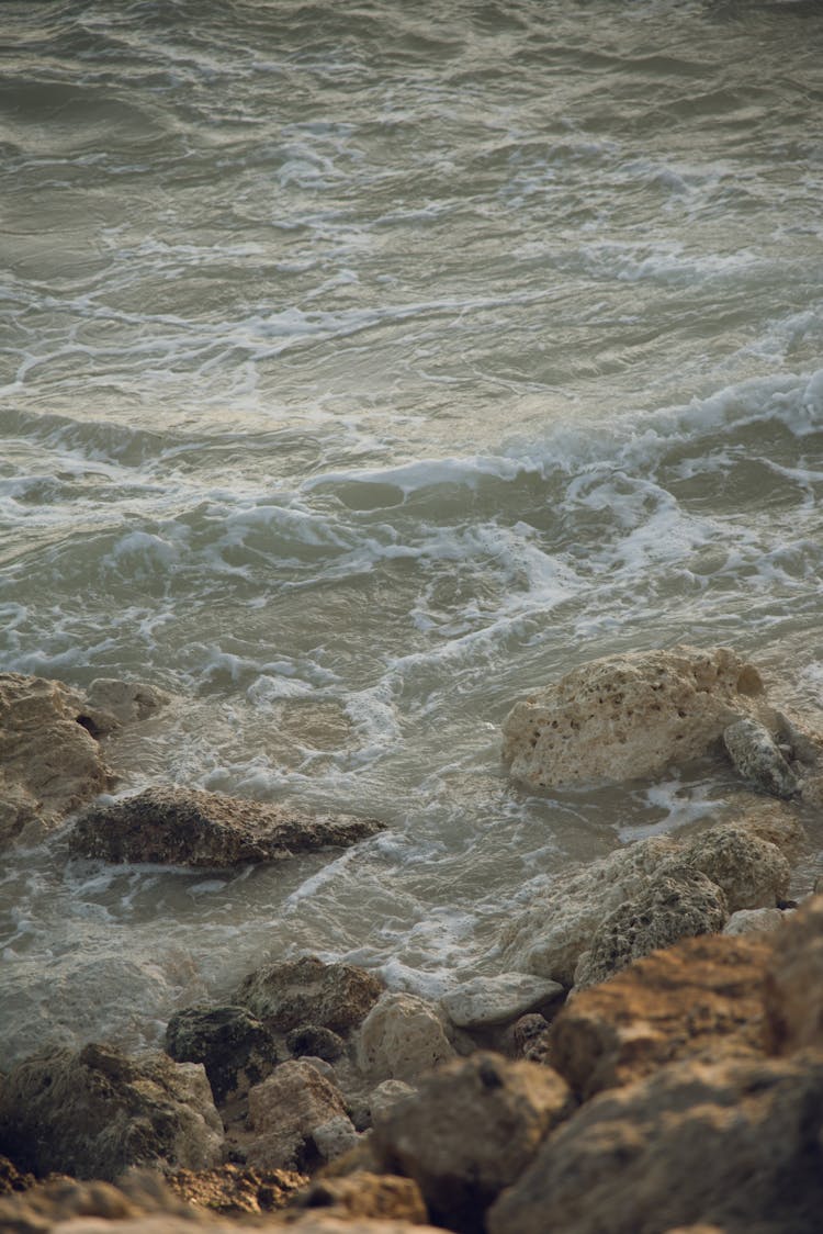 Waves Splashing On Rocks On Seashore