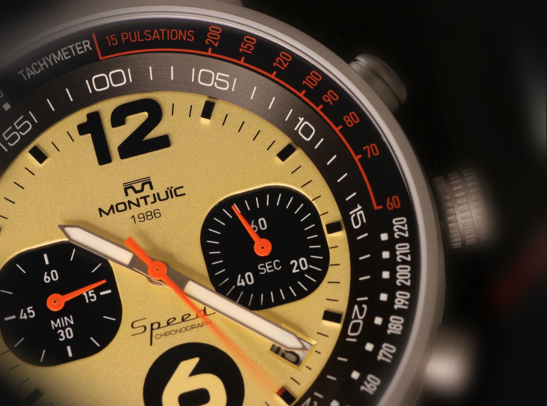 Detailed close-up of a stylish analog watch face featuring tachymeter and pulsation scale.
