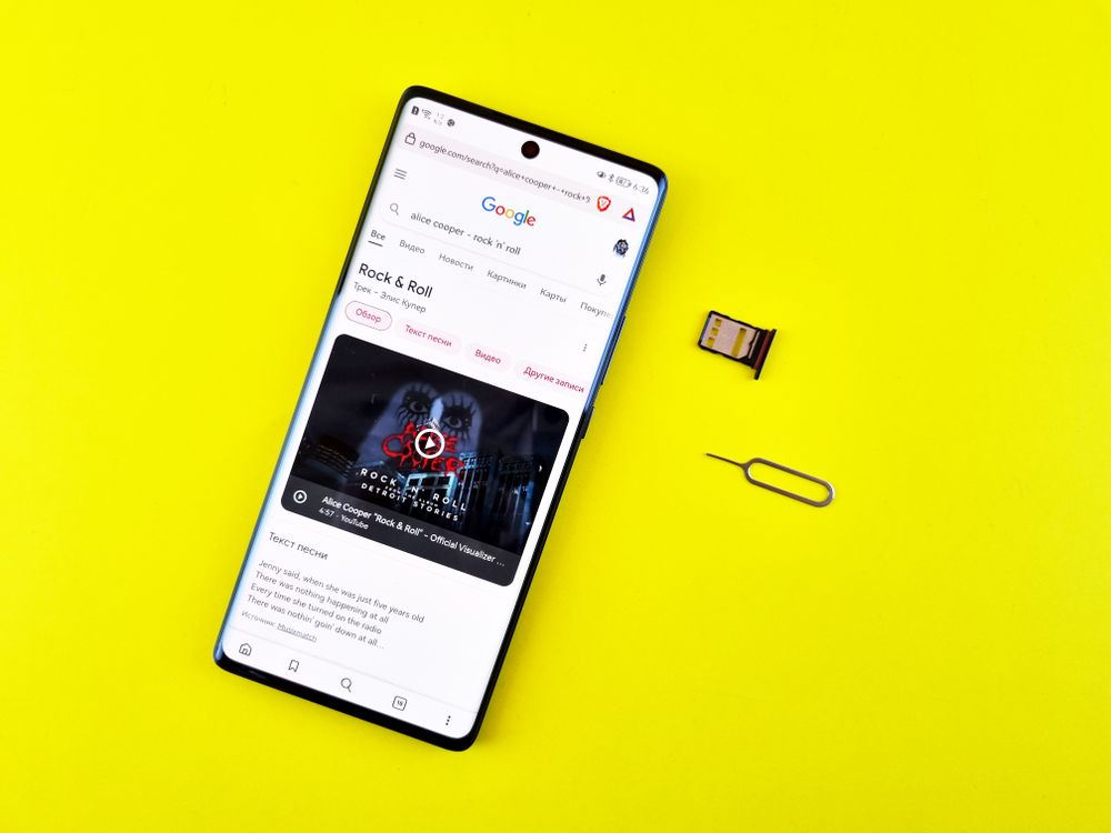 Close-Up Shot of a Mobile Phone on Yellow Surface · Free Stock Photo
