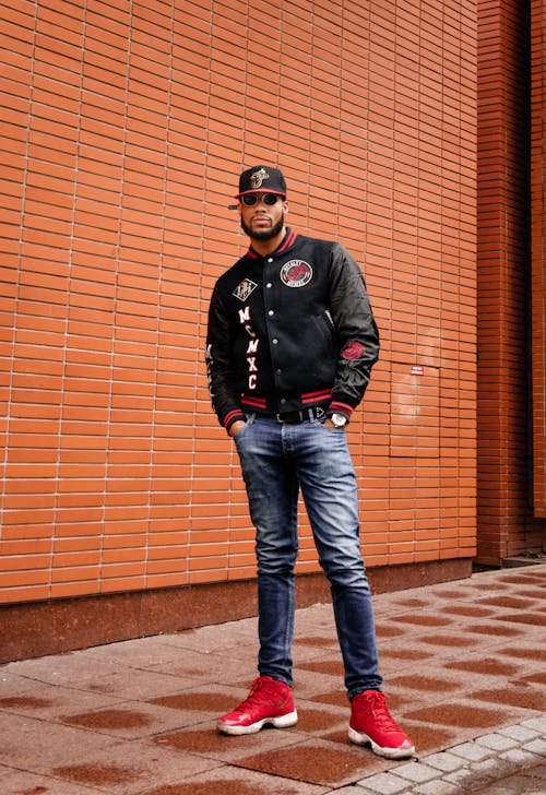 Young Man in a Black Baseball Cap and Jacket 