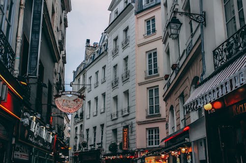 White Commercial Buildings Under Cloudy Sky