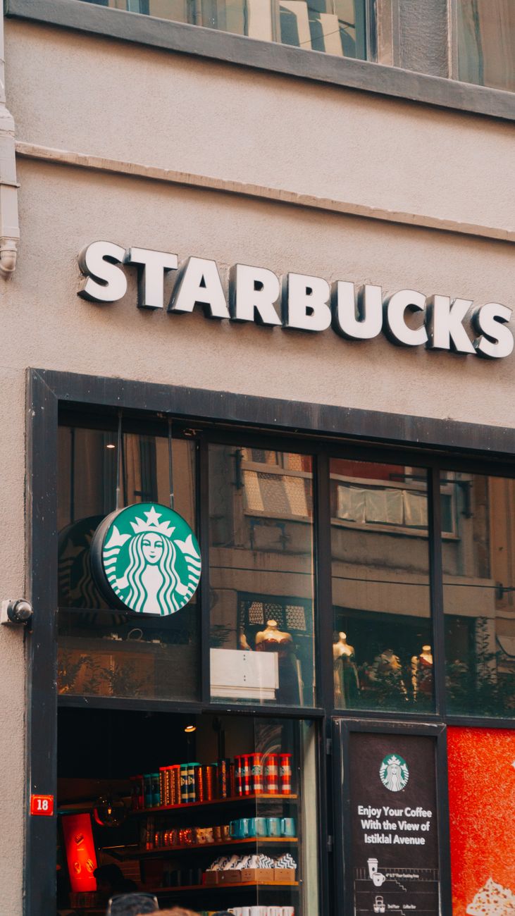 A Starbucks storefront on a busy city street, reflecting the coffee-chain model Chinese challengers are trying to adapt for overseas markets.