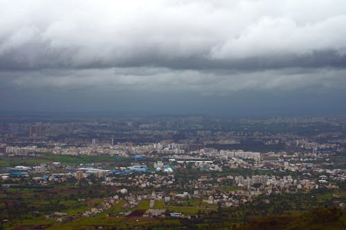 Aerial View of a City under a Cloudy Sky 